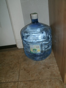 4 gallons of water in a storage safe bottle