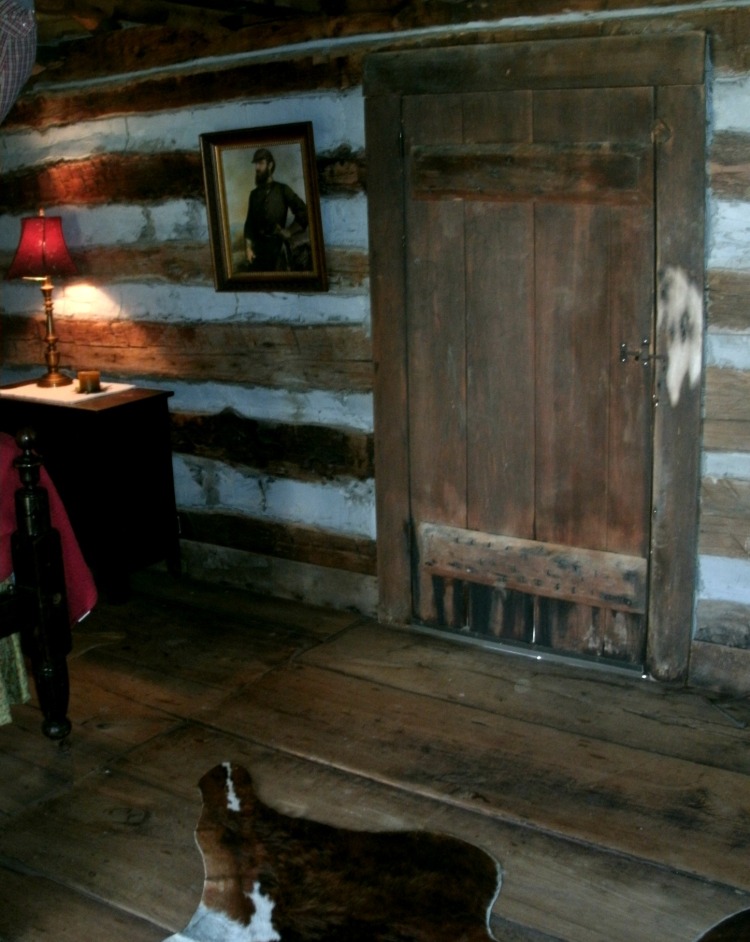 Front door of cabin with photo of Gen. Thomas "Stone Wall" Jackson