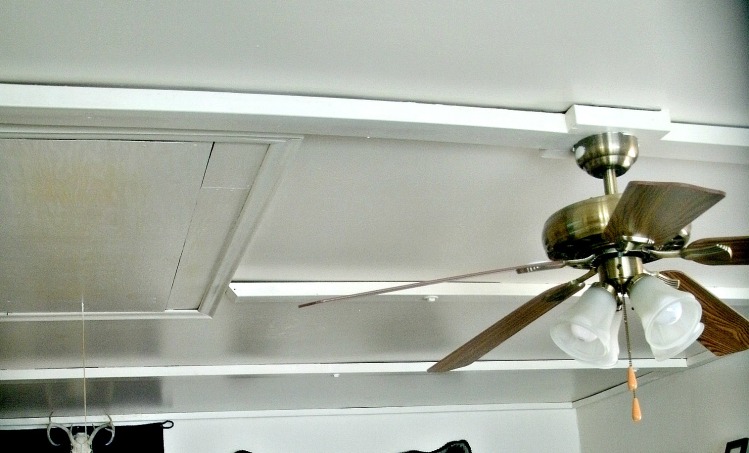 ceiling was decorated with 4x4's and 2x2's and lag bolts.