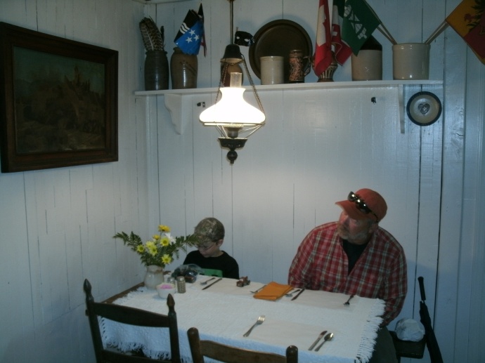 Tom and Christopher Powers looking over wall decor at the Hutte Haus Swiss restraunt, Helvetia WV