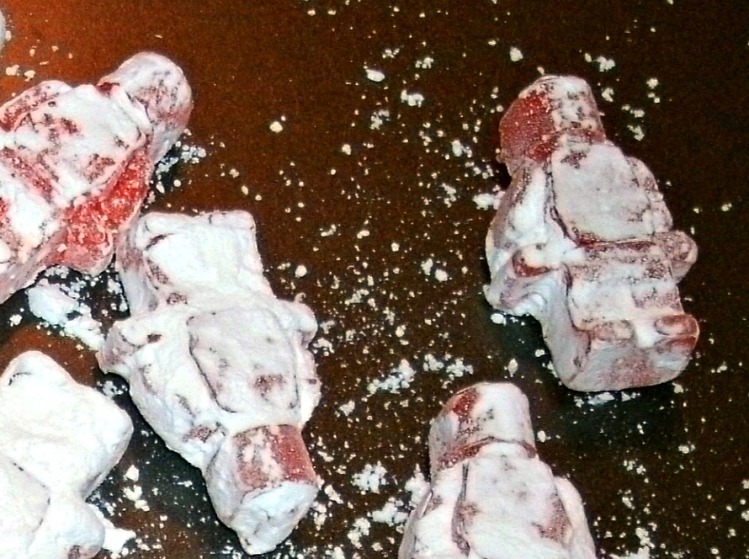 Close up of hard candy Lego men with powdered sugar