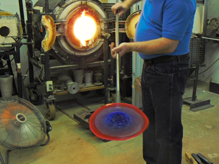 Ron Hinkel spinning a dish of glass